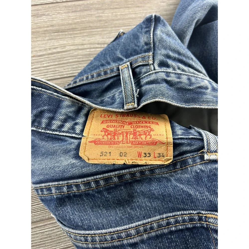 LEVI'S STRAUSS & CO Men's 521 02 Straight Regular Jeans Size W33 L34